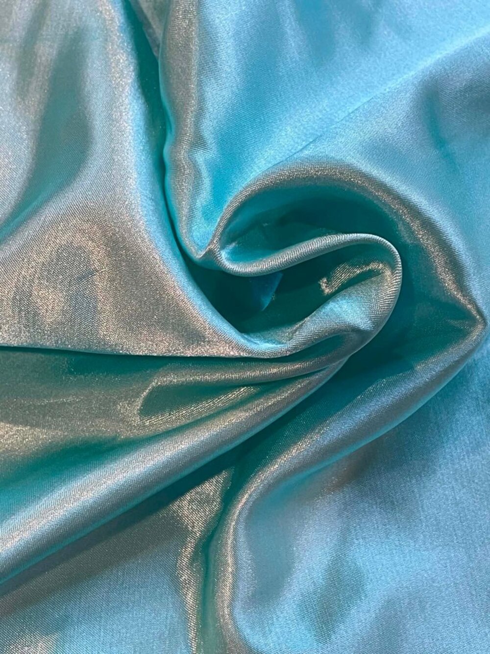 Aqua blue satin fabric.  Sold by the yard.